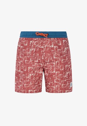 Bañador de hombre con un patrón de hojas en rojo y crema, cinturilla elástica azul con cordón naranja y etiqueta de marca en el lateral.