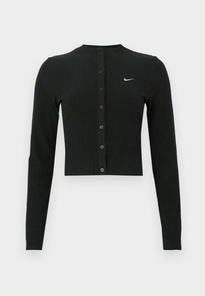 Cardigan noir côtelé à manches longues avec une coupe courte, des boutons sur le devant et un petit logo Nike blanc sur le côté gauche.