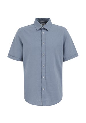 Chemise à manches courtes, de couleur bleu clair, en lin. Présente un col évasé et six boutons à l'avant, avec un ourlet arrondi et une texture douce.