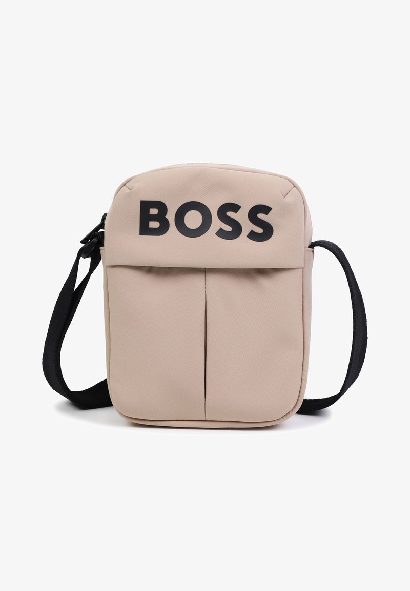 Beige nylon shoulder bag with black "BOSS" logo, two front pockets, adjustable black strap, and a zip closure on top.