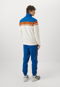 Sergio Tacchini DAMARINDO SET - Tepláková súprava - nautical blue/gardenia/mocha bisque