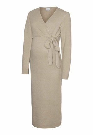 Bež oblečena nosečniška obleka s prekrivnim dizajnom, dolgimi rokavi in zavezanjem v pasu. Gladka tekstura in dolžina do sredine meč.