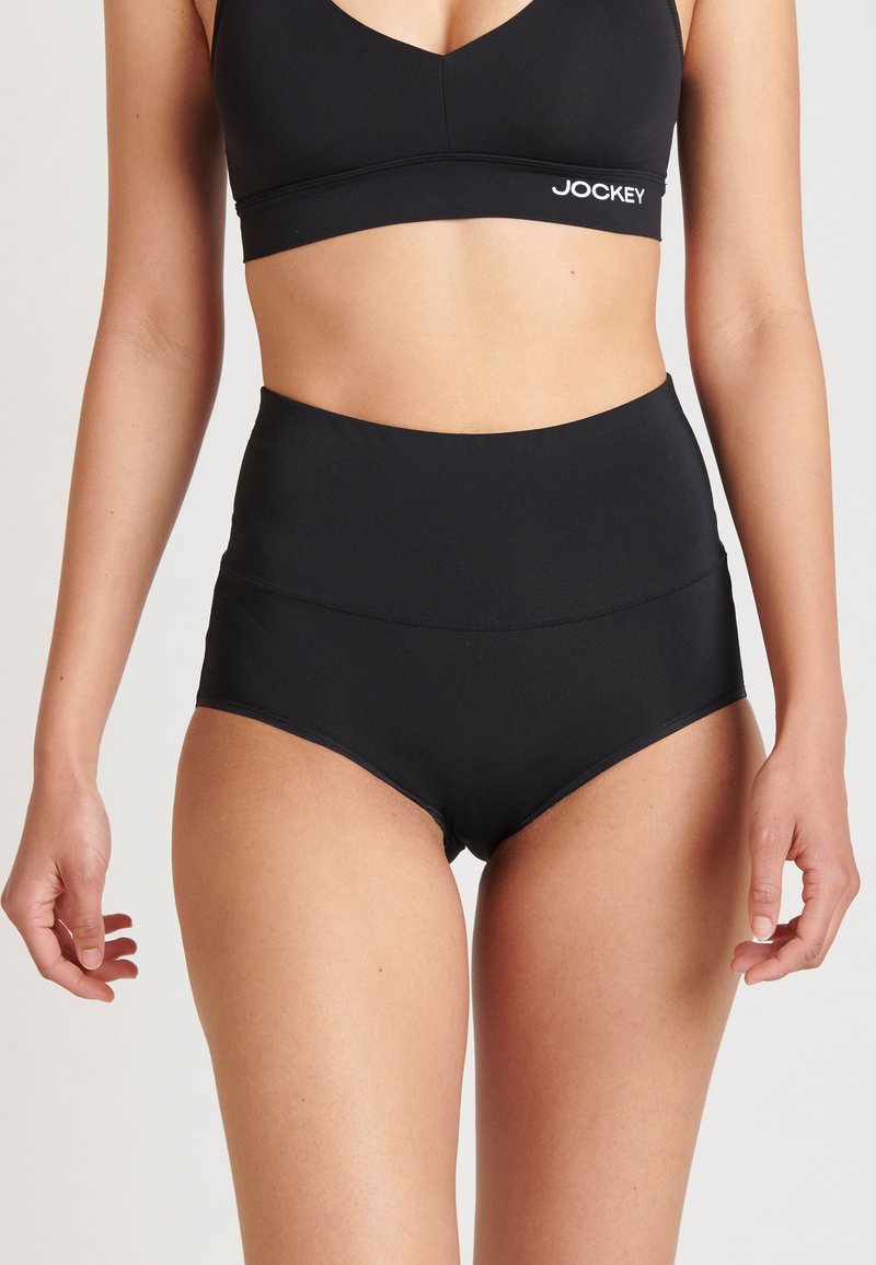 Hochgeschnittene schwarze Unterwäsche aus glattem Material mit nahtlosem Design und breitem elastischen Bund für Komfort.