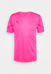 Růžový sportovní dres s krátkým rukávem a výstřihem do V, vyrobený z lehké látky, s tónovaným logem na levé horní straně a kontrastními pruhy po stranách.