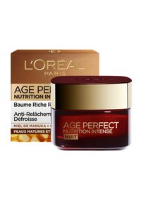 Crème de nuit L'Oréal Age Perfect Nutrition Intense dans un pot en verre rouge foncé avec un couvercle doré. L'emballage présente un design en or et en nid d'abeille.
