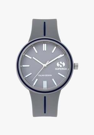 Rundwanderuhr mit grauem Silikonarmband und grauem Zifferblatt. Verfügt über silberne Stundenmarkierungen und Zeiger sowie ein Logo an der Position 6 Uhr.