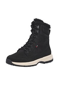 Schwarze Wanderschuhe mit einem Obermaterial aus Wildleder und Textil, einem Kunstfellkragen, robusten Schnürsenkeln und einer cremefarbenen Gummisohle für Grip und Unterstützung.