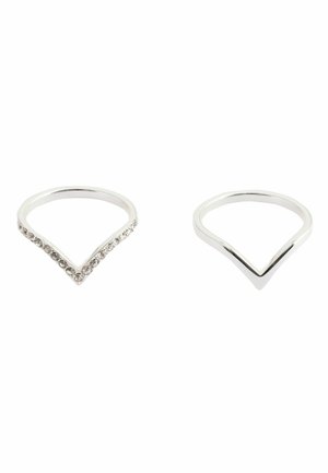 Two silver V-shaped rings on a white background, one plain and one adorned with small clear gemstones along the top edges.