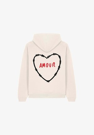 Felpa chiara con un design di cuore cucito nero e la parola "AMOUR" in rosso. Presenta un cappuccio con coulisse e polsini a costine.