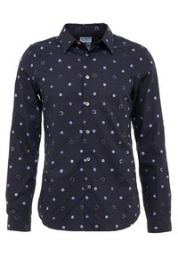 Marinblå skjorta med långa ärmar, med ett mönster av ljusblå cirklar och handritade detaljer. Slät tyg, klassisk kragdesign.
