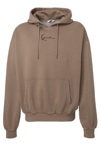 Hoodie in lichtbruin, gemaakt van zacht stof. Voorzien van een voorzak, elastische manchetten en een zwart geborduurd logo op de borst.
