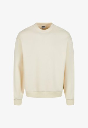 Kreklai ar apaļu apkakli gaismas krēmkrāsā, izgatavoti no mīksta auduma, ar ribotām piedurknēm un apakšmalu, ar vienkāršu, neizpušķotu dizainu.