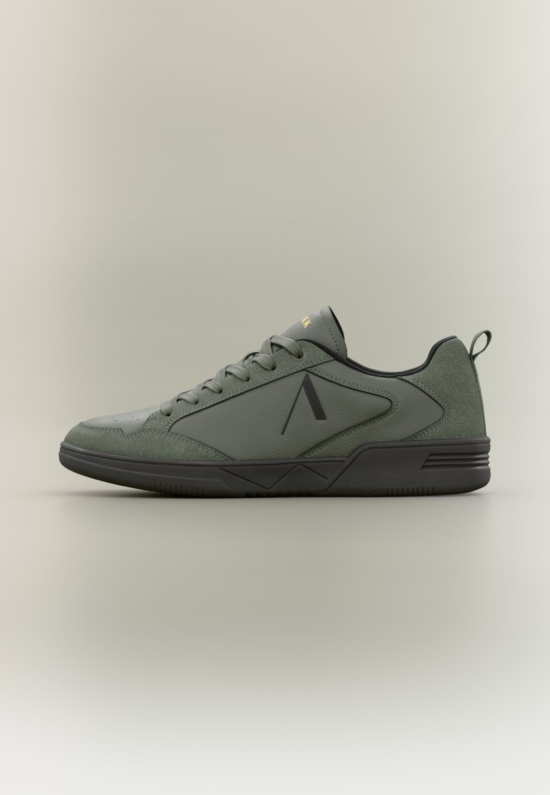 Green athletic shoes featuring leather and textile, a low-profile design, black rubber sole, and subtle logo detailing on the side.