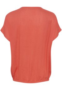 Blusa leggera color corallo con scollatura rotonda, maniche corte e orlo arricciato per una vestibilità rilassata. Tessuto liscio, senza disegni.