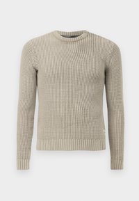 Maglione beige lavorato a maglia con collo rotondo, maniche lunghe, polsini e orlo a coste. Presenta un motivo a rilievo su tutto il tessuto.