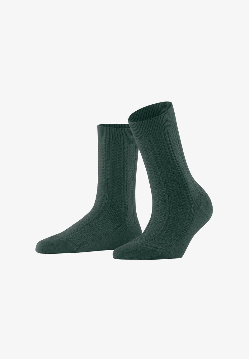 Dark green cotton socks with ribbed top, textured body, and reinforced toe. Ankle-length with distinctive pattern and smooth finish.