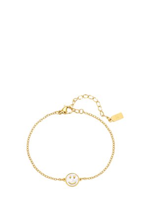 Delicate gold chain bracelet with a circular white center featuring a gold smiley face, and an adjustable clasp with a small tag.