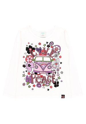 Chemise blanche à manches longues avec un van vintage rose, des fleurs colorées et les mots « Love & Peace » en lettres décoratives sur le devant.