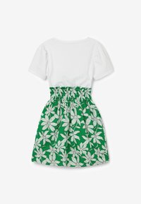 Klänning med kort ärm som har en vit överdel och en grön kjol prydd med vita blommönster. Elastisk midja för en flexibel passform.