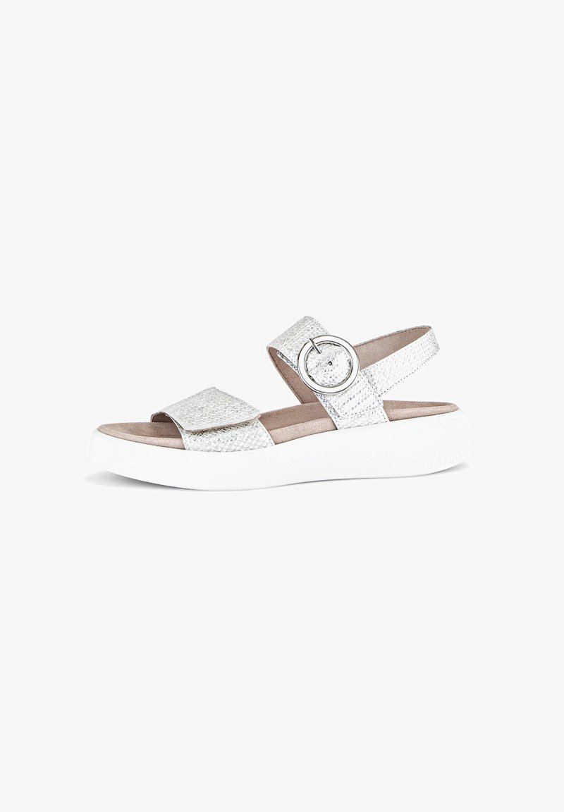 Silver textured sandal with a wide strap, adjustable buckle, and a white platform sole. Features a flat footbed for comfort.