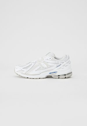 White athletic shoe with a breathable mesh upper, synthetic accents, textured sole, and blue detailing on the side. Low profile design.