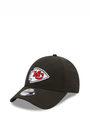 Black adjustable baseball cap with Kansas City Chiefs logo in red and white on front and New Era branding on side.
