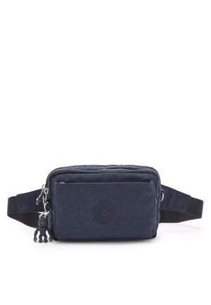 Navy nylon crossbody bag with a front zip pocket, adjustable strap, rubber logo accent, and a small rubber monkey charm attached.