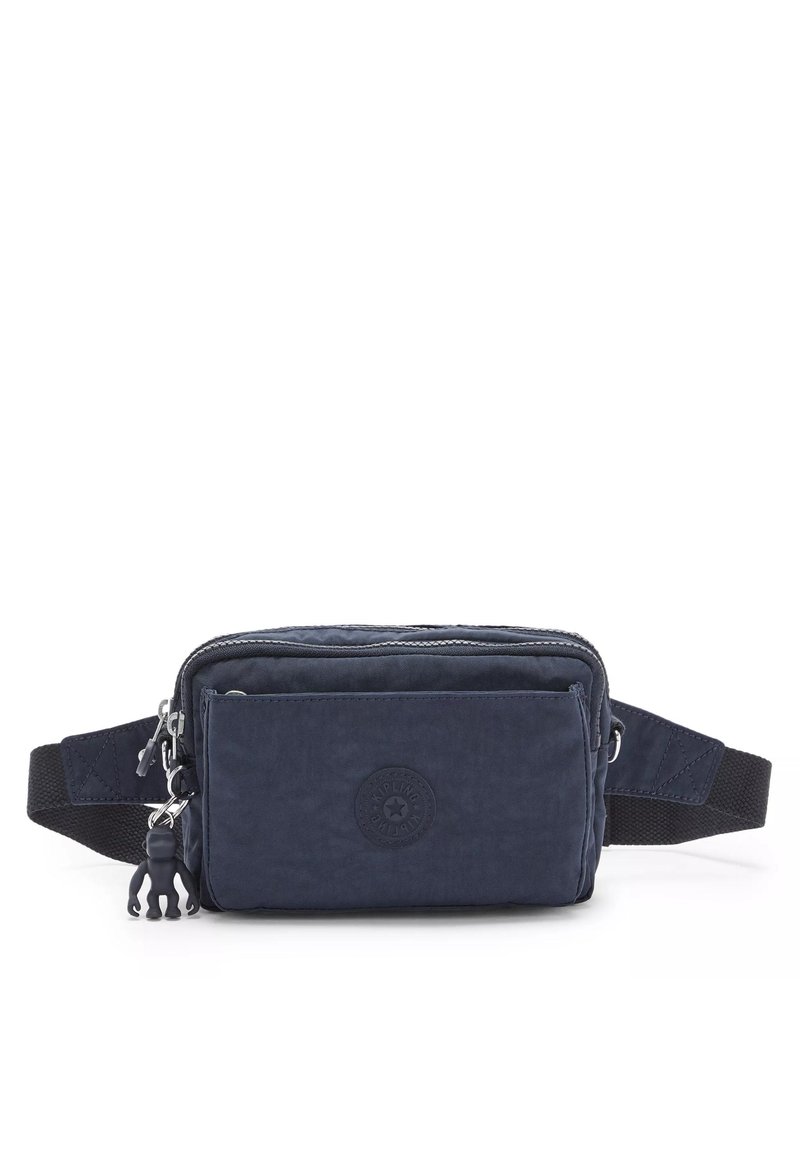 Navy nylon crossbody bag with a front zip pocket, adjustable strap, rubber logo accent, and a small rubber monkey charm attached.