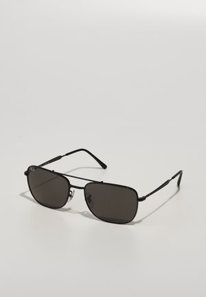 Black sunglasses with rectangular lenses, metal frames, and thin temples. Features tinted lenses and subtle branding on the frame.