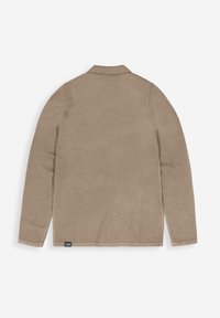 Beige Langarmhemd mit einem Kragen, weicher Textur und einem Etikett auf der unteren linken Seite. Einfaches Design ohne Muster oder Akzente.