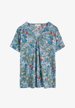 Īsām piedurkņu tops, izgatavots no viegla auduma, ar zilu ziedu rakstu un sarkaniem akcentiem, ar V veida kakla izgriezumu un brīvu piegulst.