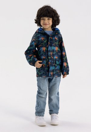 Veste de pluie pour enfants en tissu imperméable, avec une base bleu marine ornée de motifs de dinosaures colorés. Comprend une capuche et des poignets élastiques.