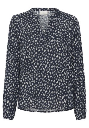 Blusa azul marino con escote en V, mangas largas y corte holgado. Presenta un patrón abstracto blanco. Confeccionada en un tejido ligero y texturizado.