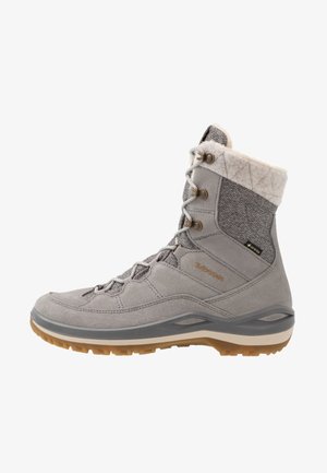 Botte imperméable grise avec doublure beige douce, accents en tissu texturé et fermeture à lacets. La semelle en caoutchouc offre traction et stabilité.