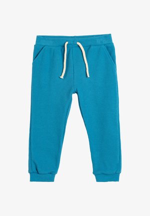 Turquoise geribde sweatpants met elastische tailleband, trekkoord en zijzakken; aansluitende boorden bij de enkel.