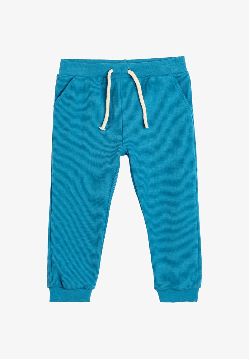 Turquoise geribde sweatpants met elastische tailleband, trekkoord en zijzakken; aansluitende boorden bij de enkel.