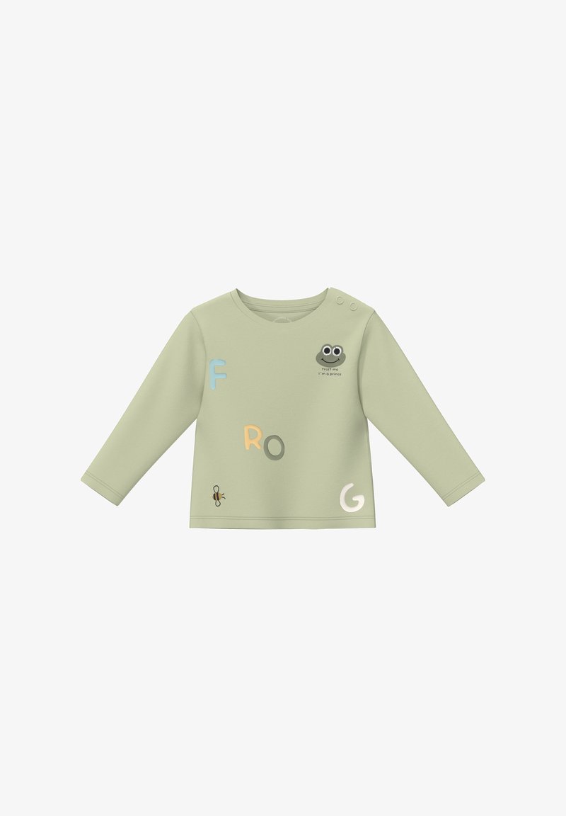 Chemise à manches longues vert clair pour tout-petit avec visage de grenouille et texte "Fais-moi confiance, je suis un prince", lettres dispersées F, R, O, G, et une petite illustration d'abeille.