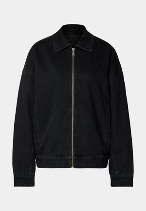 Black denim jacket with a zip front, pointed collar, and side pockets. Features minimalistic design and subtle logo detail on the chest.
