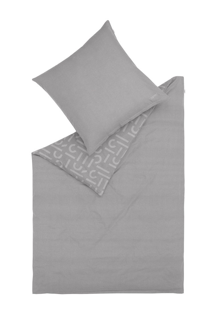Ensemble de linge de lit gris comprenant une housse de couette et une taie d'oreiller assortie, fabriqué en tissu doux avec un motif géométrique subtil d'un côté.