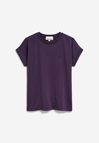 T-shirt violet à manches courtes en coton avec revers roulés et col rond, arborant un petit logo brodé sur le côté gauche de la poitrine.