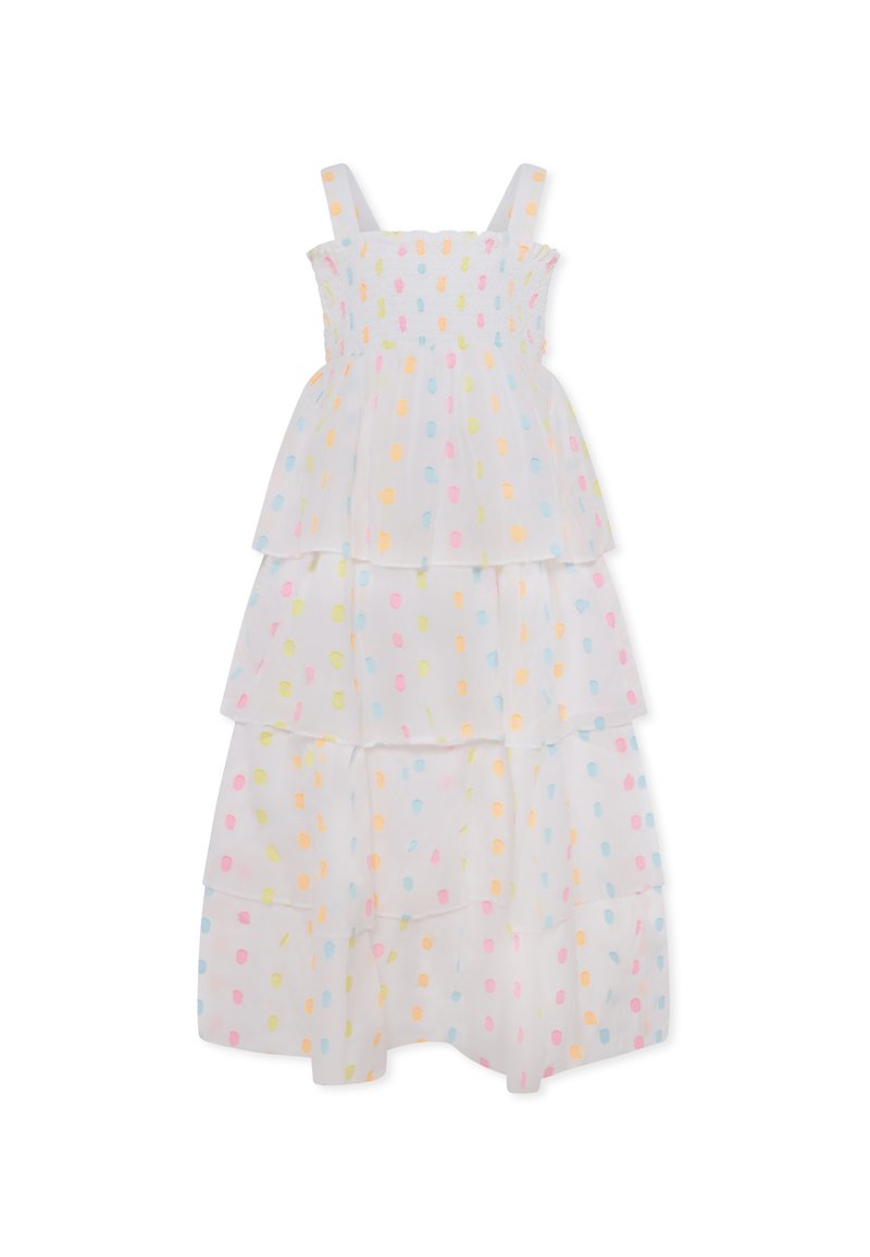 Robe blanche à volants ornée de pois pastel en jaune, rose et bleu. Conçue avec des bretelles spaghetti et un corsage smocké.