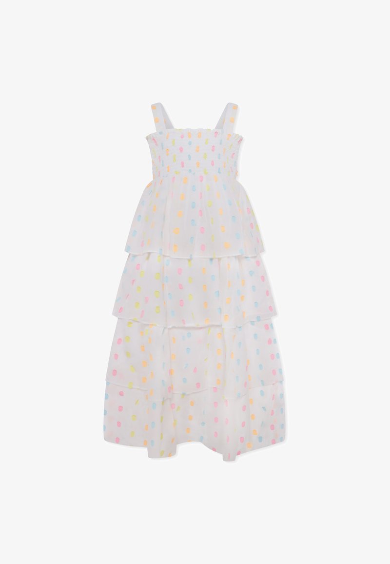 Robe blanche à volants ornée de pois pastel en jaune, rose et bleu. Conçue avec des bretelles spaghetti et un corsage smocké.