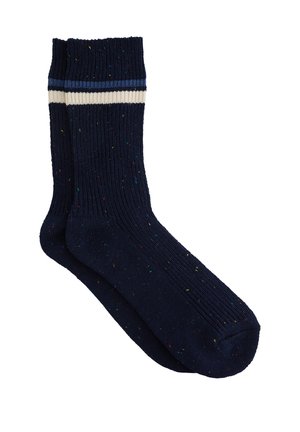 Sötétkék bordázott zoknik, több színű foltokkal és fehér-kék csíkos passzéval. Texturált kötött anyagból készült.