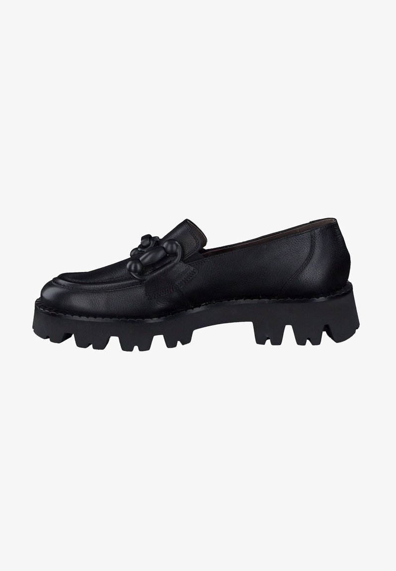 Mocassin en cuir noir avec semelle crantée épaisse et détail décoratif de nœud sur le dessus, vu de profil sur fond blanc.