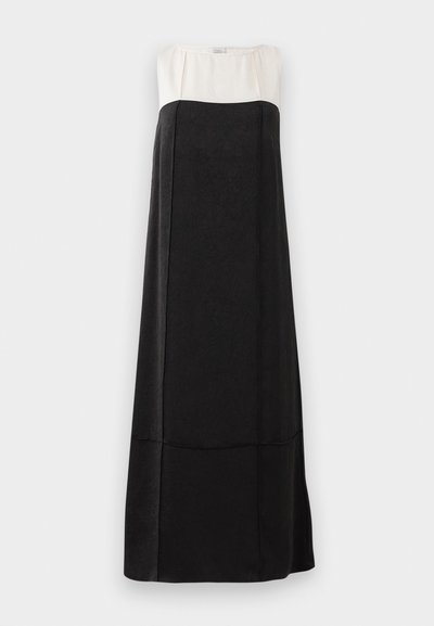 Maxi kleit, millel on must tekstureeritud alumine osa ja sile valge ülemine osa. Omab ümarat kaelust ja sirget siluetti.