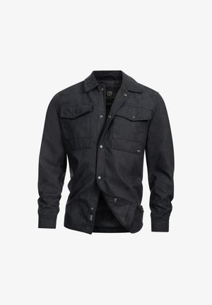 Black suede shirt jacket with a classic collar, snap buttons, two chest pockets, and long sleeves. Smooth texture and tailored fit.