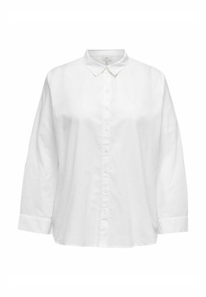 Fehér pamut ing klasszikus gallérral, hosszú ujjal és laza szabással. Elöl gombokkal és mandzsetta részletezéssel rendelkezik.