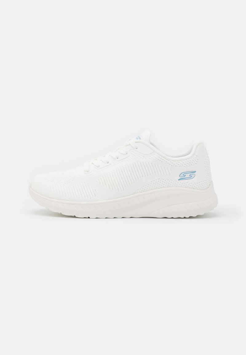 White athletic sneaker with a textured mesh upper, accented with a light blue logo. Features a cushioned sole and rounded toe design.