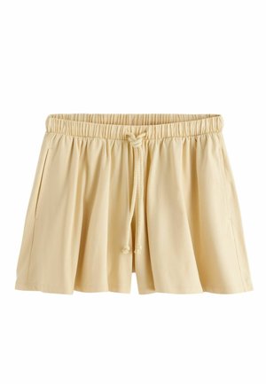Bézs pliszírozott rövidnadrág rugalmas derékpánttal és elöl megkötővel, oldal zsebekkel, fehér háttéren bemutatva.