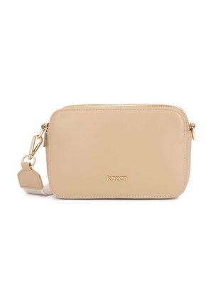 Sac bandoulière rectangulaire beige avec fermeture éclair dorée et ferrures, bandoulière amovible, et logo "kazar" centré sur le devant.
